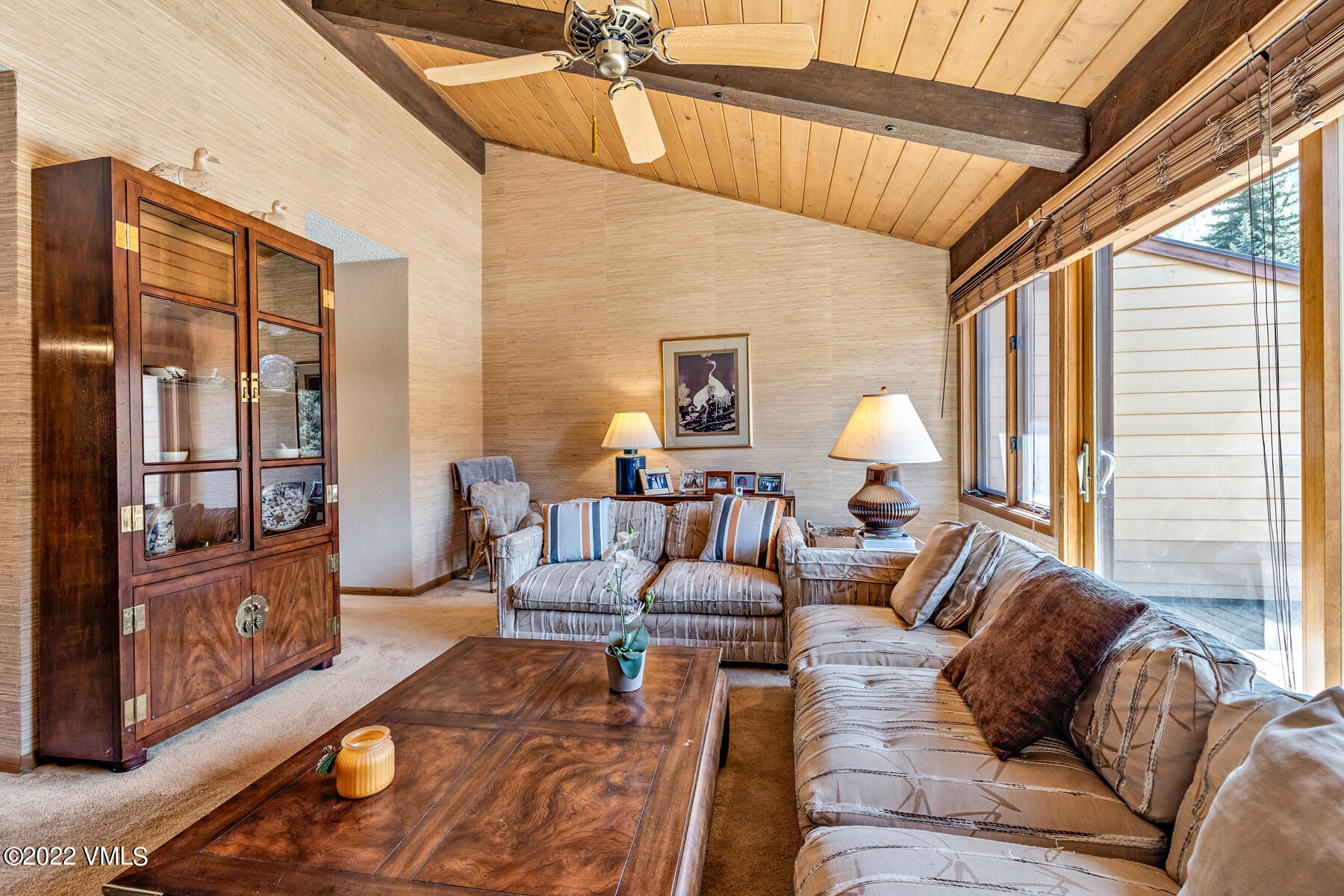 1750 South Frontage Road West, Unit E3 Vail, CO 81657 - Photo 8 of 39 a living room with furniture wooden floor and a large window
