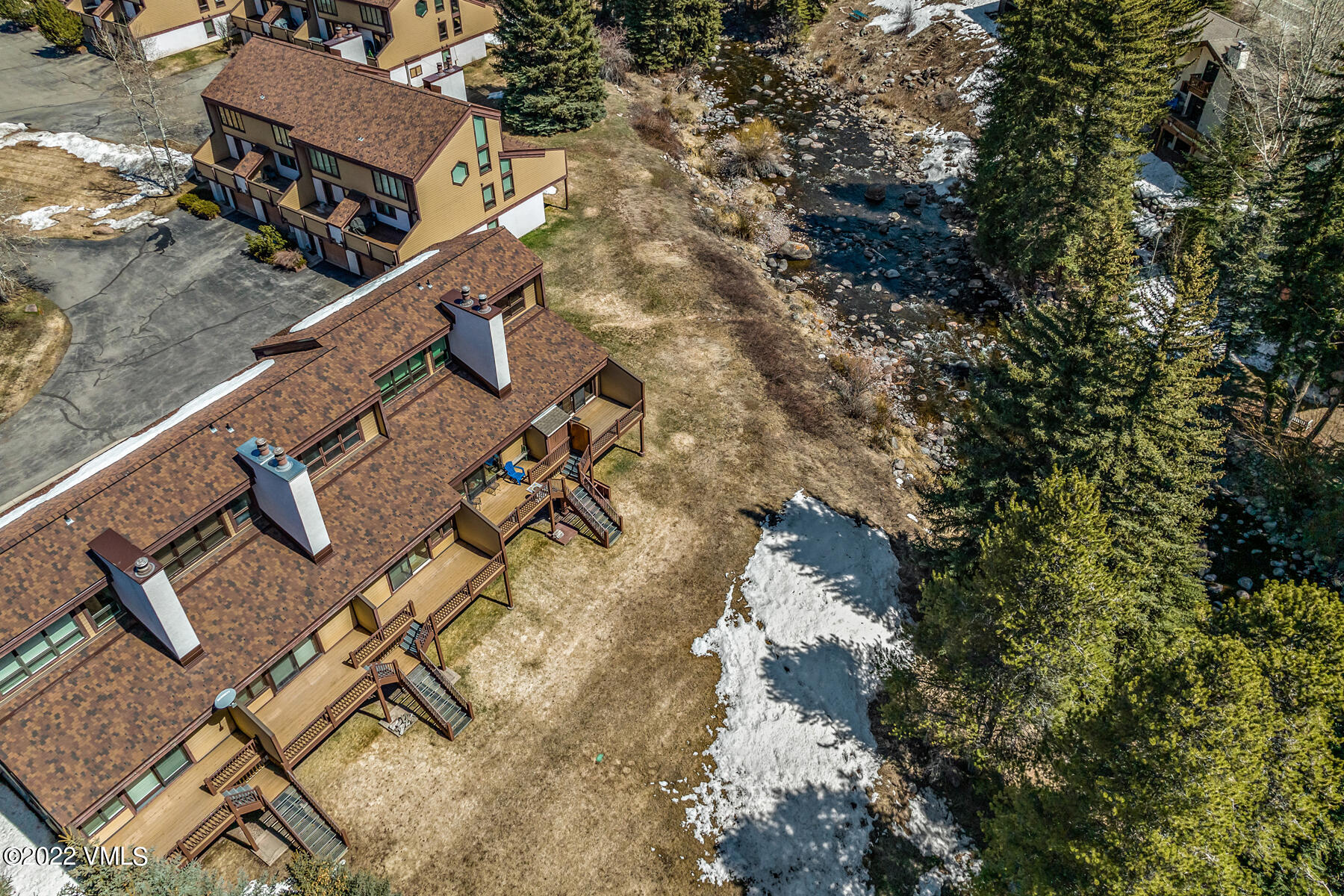 1750 South Frontage Road West, Unit E3 Vail, CO 81657 - Photo 10 of 39 an aerial view of houses with yard