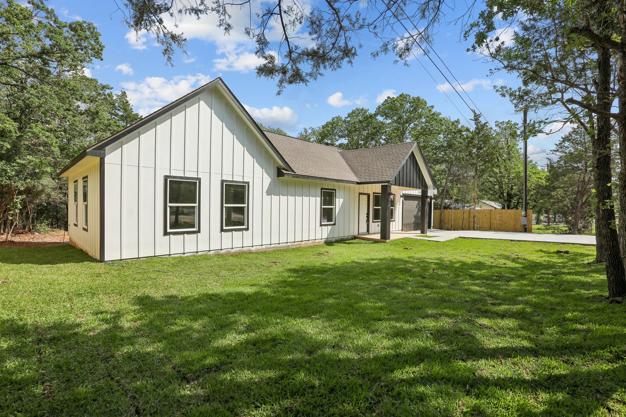 210 Flint Ridge Street Bastrop, TX 78602 - Photo 2 of 40 a view of a house with a yard
