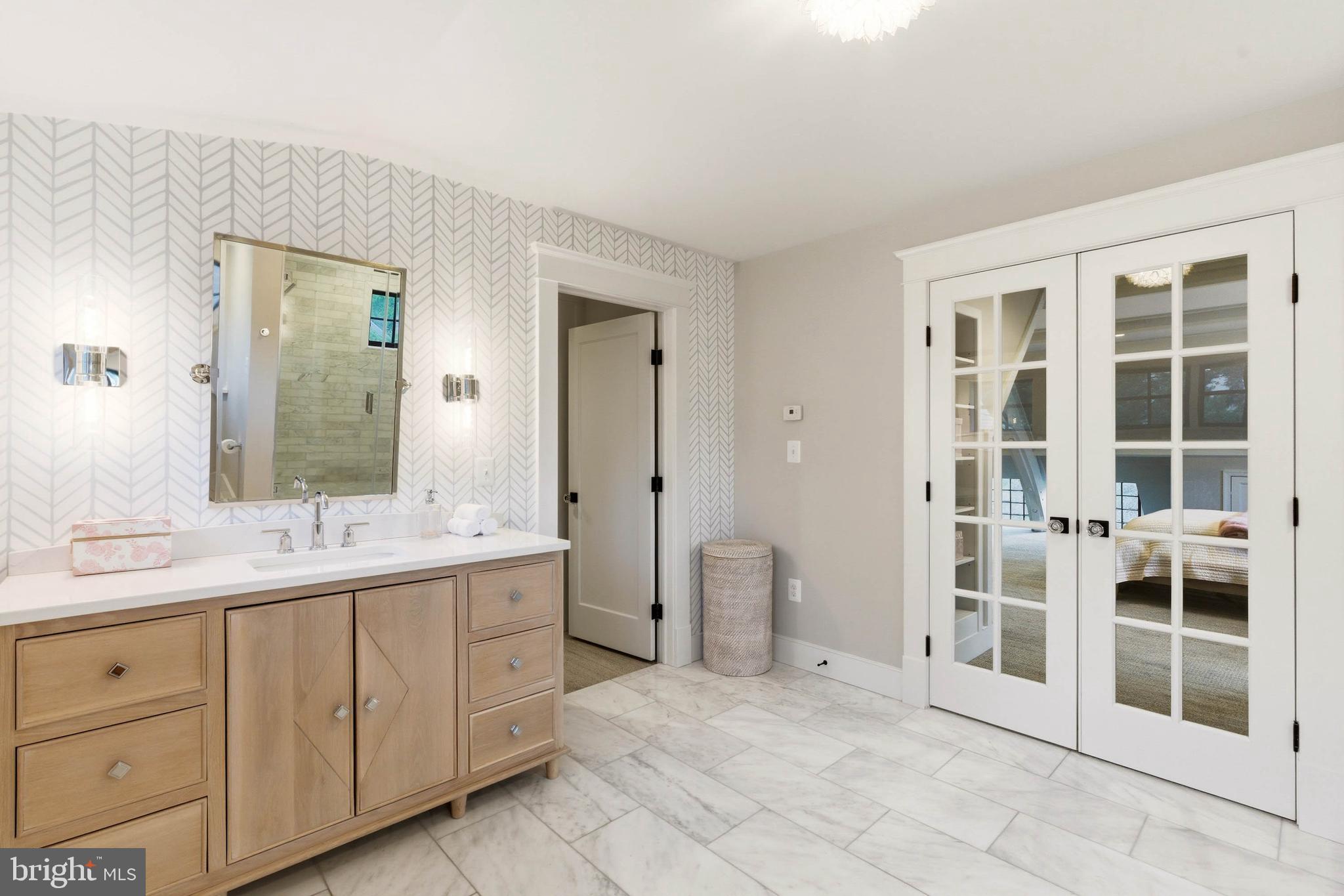 200 Ashland Road Cockeysville, MD 21030 - Photo 35 of 61 a spacious bathroom with a double vanity sink a large mirror and a bathtub
