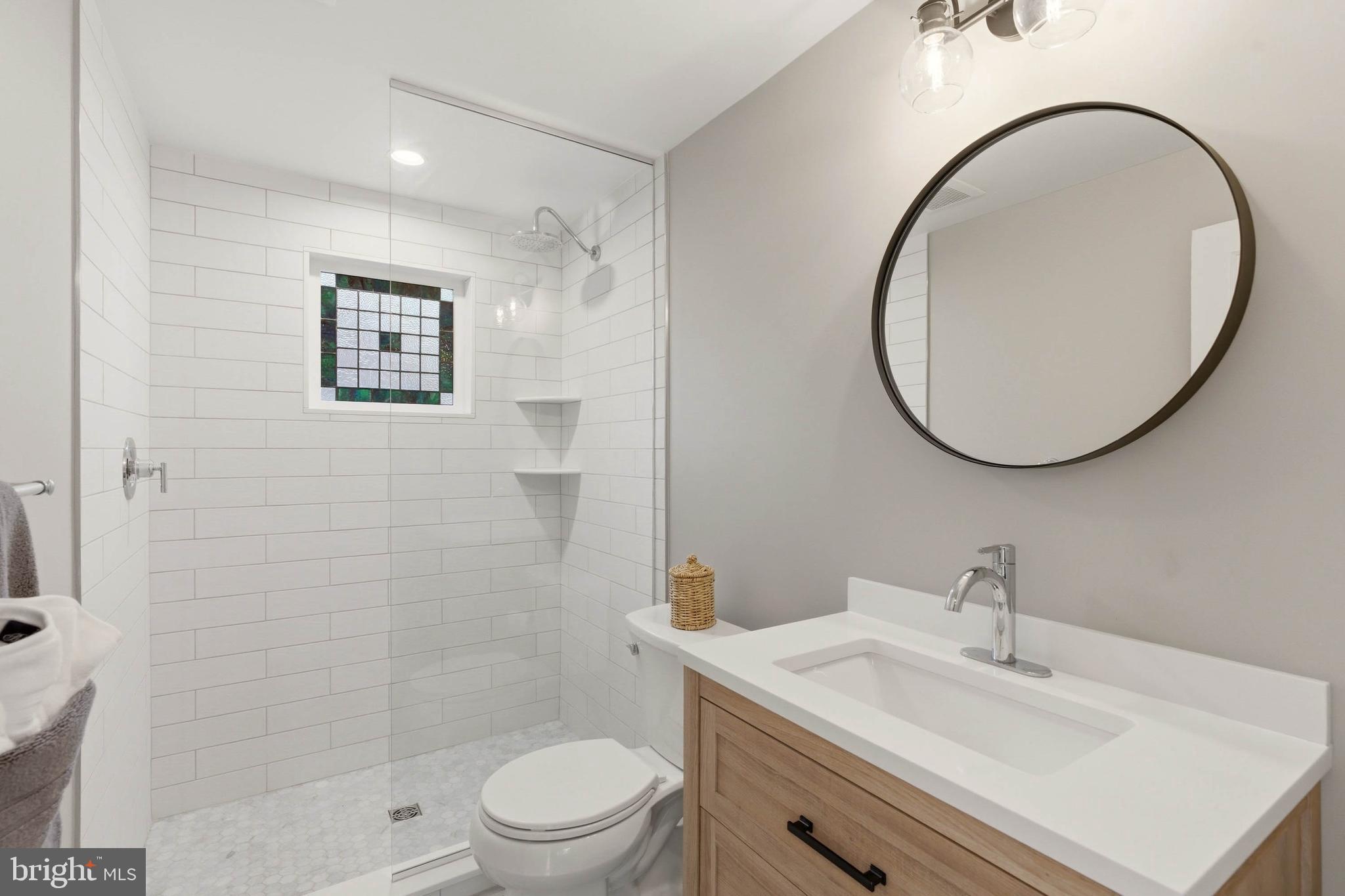200 Ashland Road Cockeysville, MD 21030 - Photo 53 of 61 a bathroom with a sink a mirror a toilet and a shower