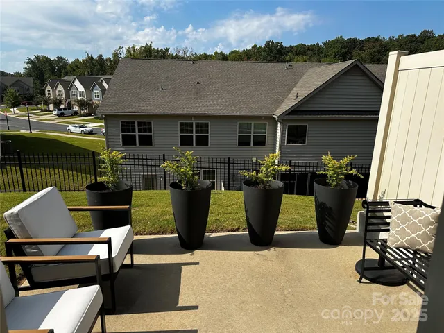 a living room with a fireplace and a wooden floor