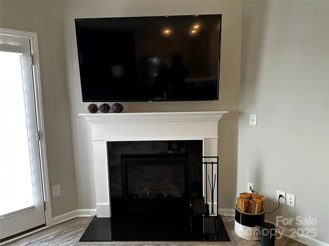 a bedroom with a bed and lamp