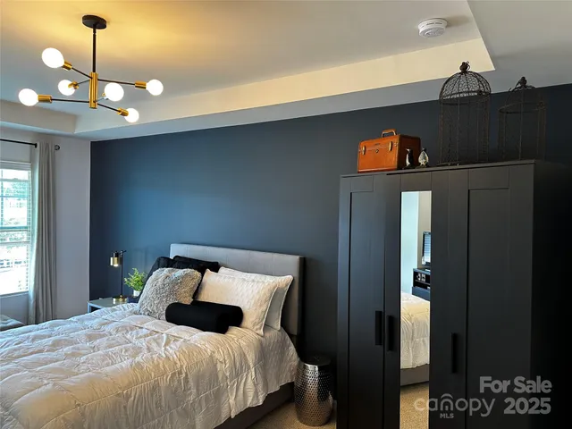 a bedroom with bed and window