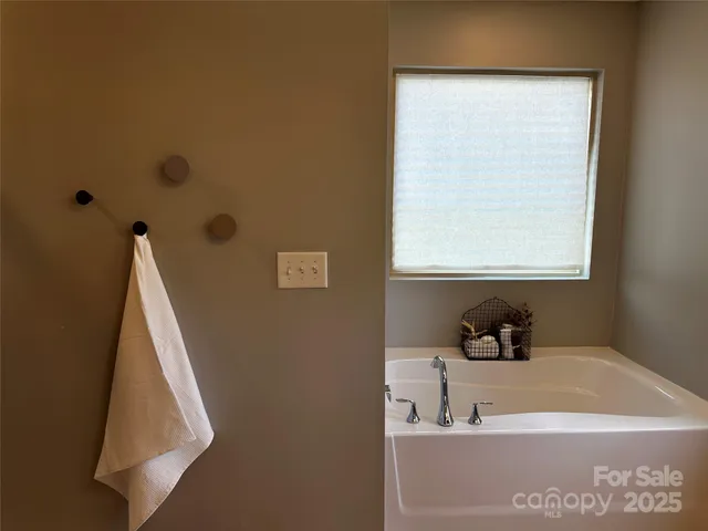 a bathroom with a toilet sink a vanity and mirror