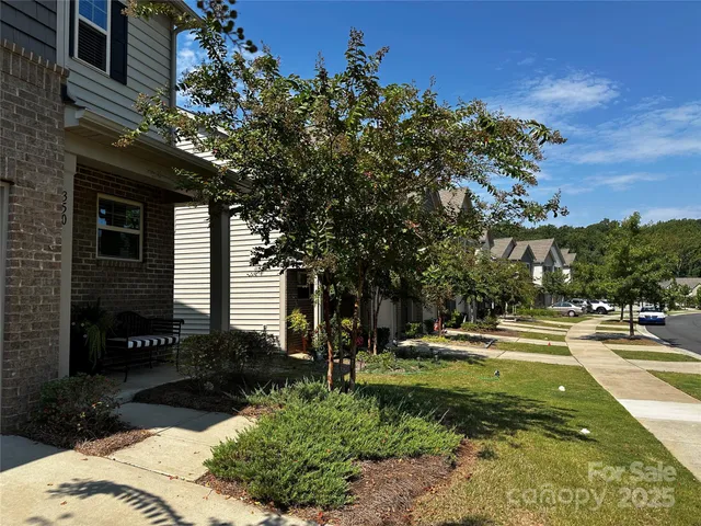 an aerial view of a house with a swimming pool