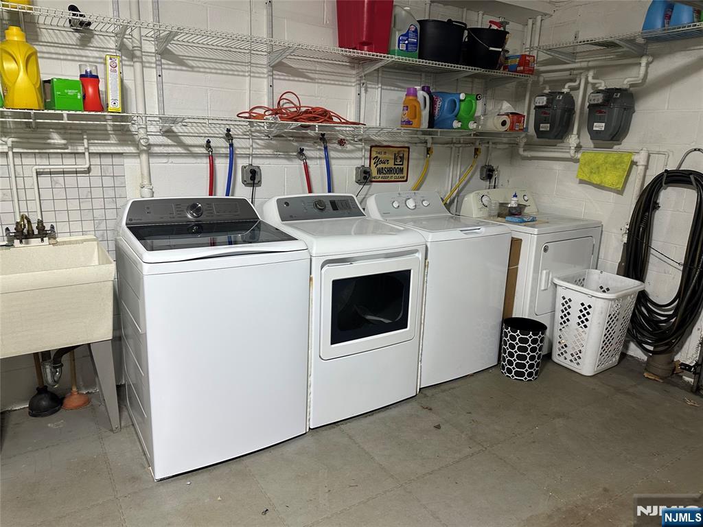 531 Day Avenue, Unit 1 Ridgefield, NJ 07657 - Photo 18 of 20 a utility room with sink dryer and washer