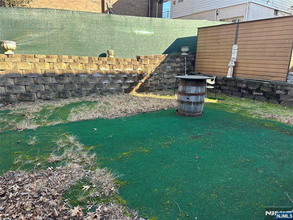 531 Day Avenue, Unit 1 Ridgefield, NJ 07657 - Photo 19 of 20 a view of a garden with two chairs