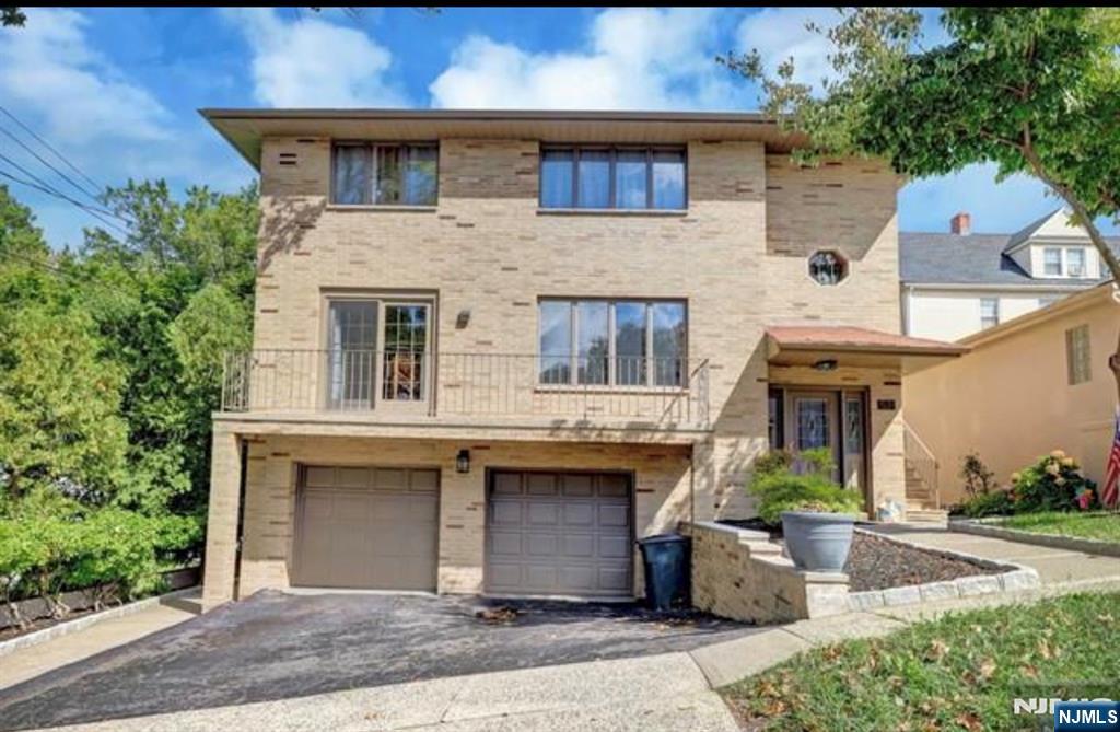 531 Day Avenue, Unit 1 Ridgefield, NJ 07657 - Photo 20 of 20 a front view of a house with garden