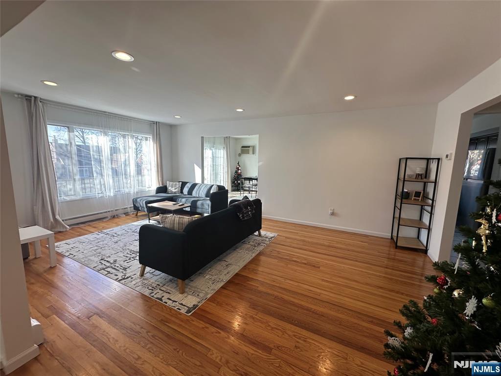 531 Day Avenue, Unit 1 Ridgefield, NJ 07657 - Photo 2 of 20 a living room with furniture window and wooden floor