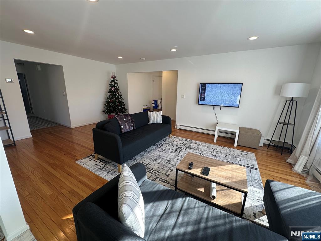 531 Day Avenue, Unit 1 Ridgefield, NJ 07657 - Photo 4 of 20 a living room with furniture and wooden floor