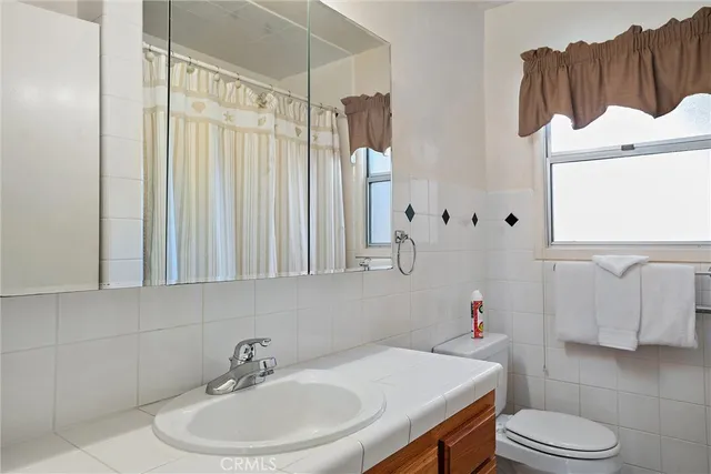a dining room with furniture and a window