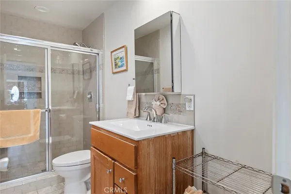a kitchen with stainless steel appliances granite countertop a sink a stove and refrigerator