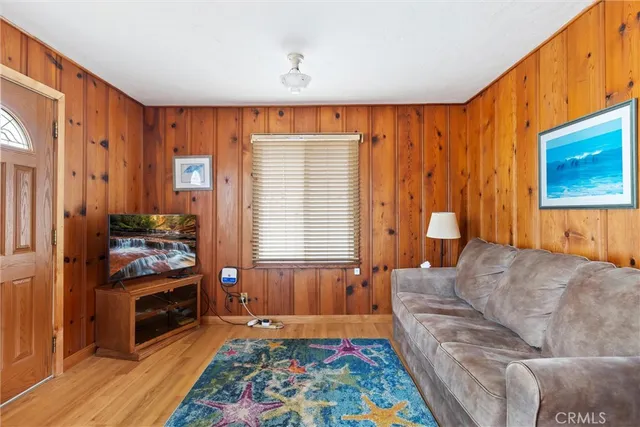 a kitchen that has a refrigerator and a table in it