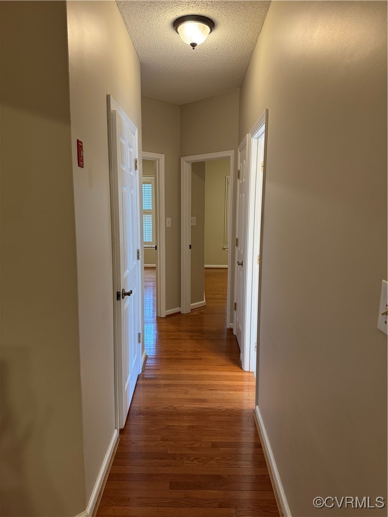 3741 Cherry Walk Williamsburg, VA 23188 - Photo 17 of 37 a view of a hallway with wooden floor