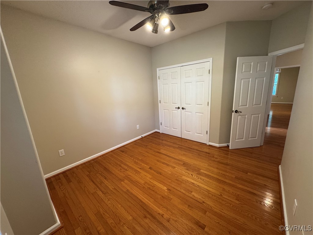 3741 Cherry Walk Williamsburg, VA 23188 - Photo 22 of 37 an empty room with wooden floor and staircase