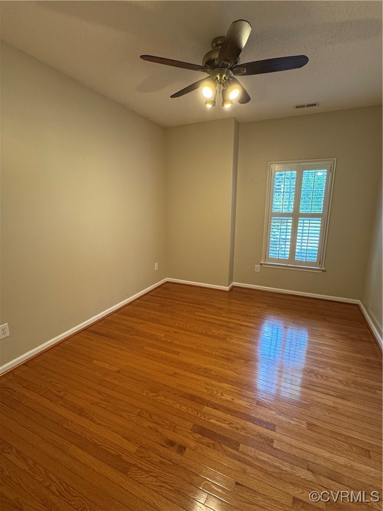 3741 Cherry Walk Williamsburg, VA 23188 - Photo 25 of 37 an empty room with wooden floor and windows