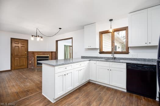 4293 Good Road Seville, OH 44273 - Photo 15 of 35 Kitchen with white cabinets and a peninsula