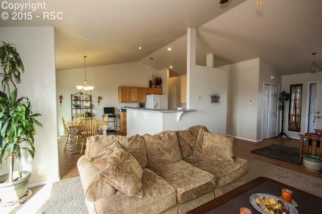 12475 Snaffle Bit Road Peyton, CO 80831 - Photo 10 of 35 Living Room looking toward Kitchen/Dining
