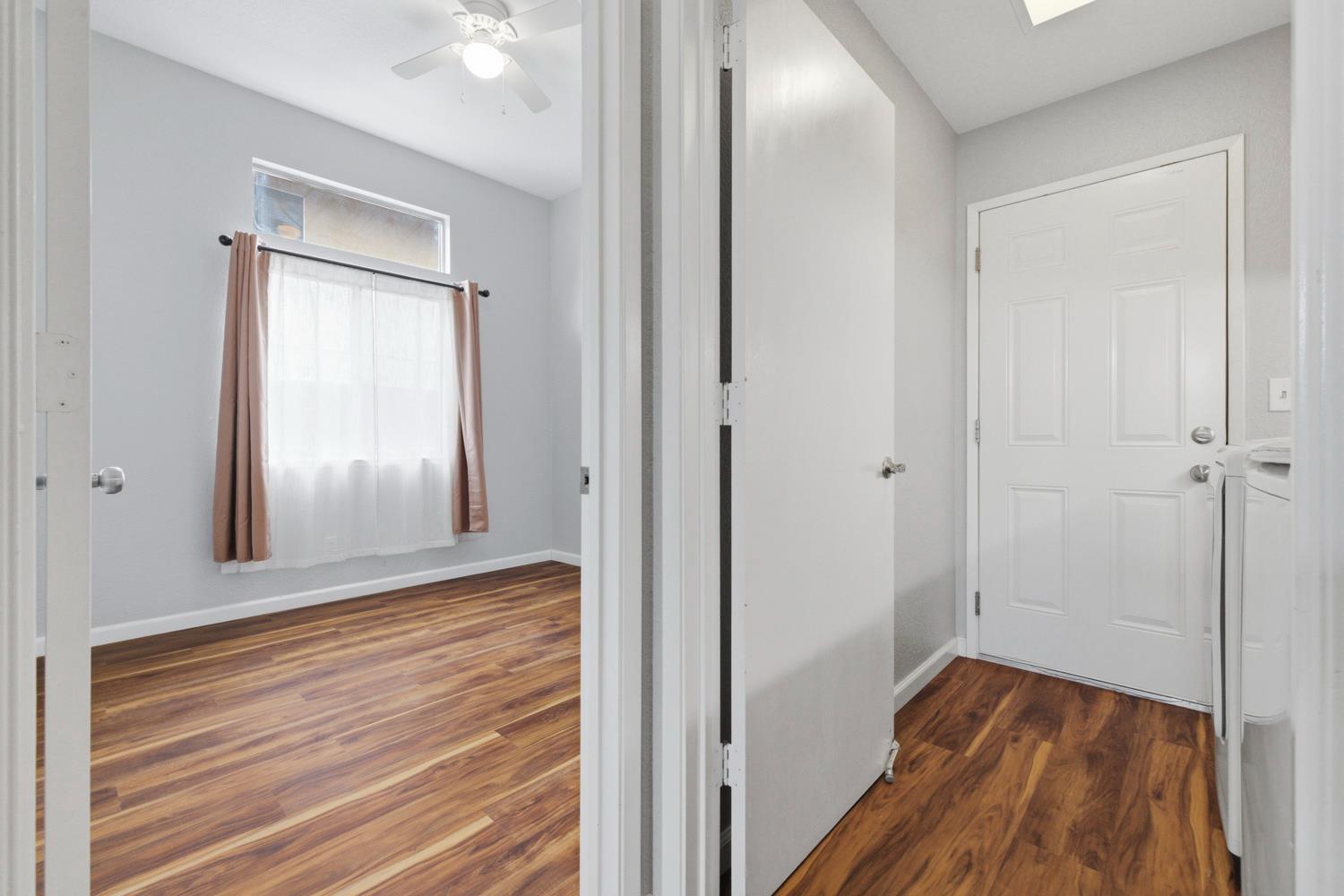 969 Colson Way Galt, CA 95632 - Photo 29 of 38 a view of a hallway with wooden floor and closet