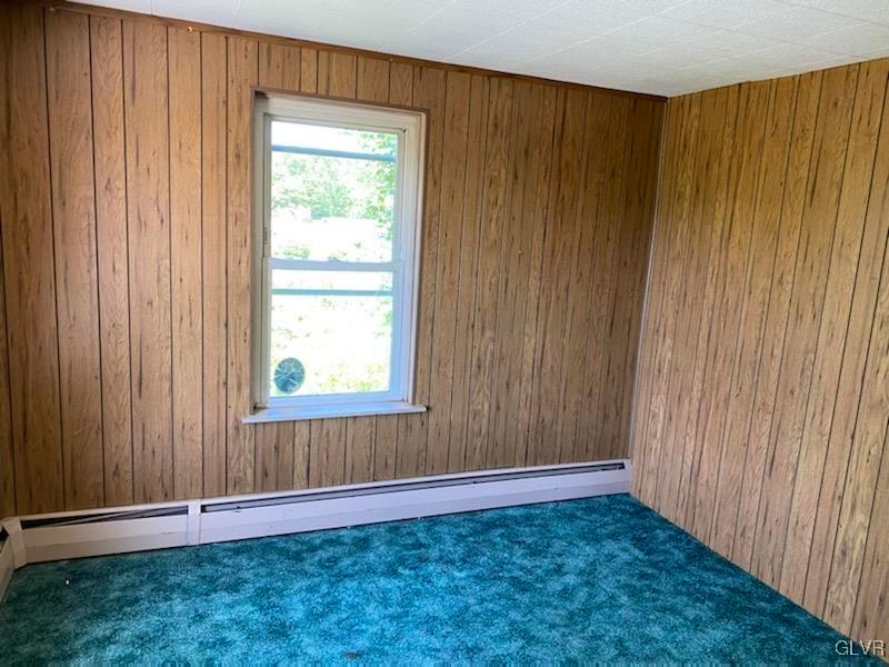 2859 Welshtown Road Slatington, PA 18080 - Photo 12 of 15 an empty room with wooden floor and windows