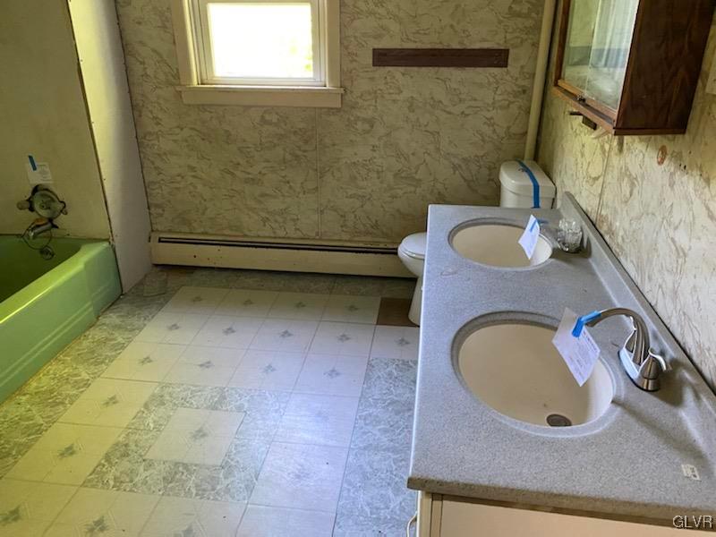 2859 Welshtown Road Slatington, PA 18080 - Photo 14 of 15 a bathroom with a sink a toilet and mirror