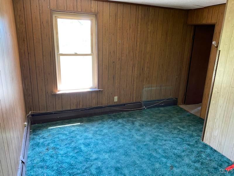 2859 Welshtown Road Slatington, PA 18080 - Photo 15 of 15 an empty room with a window and a wooden door