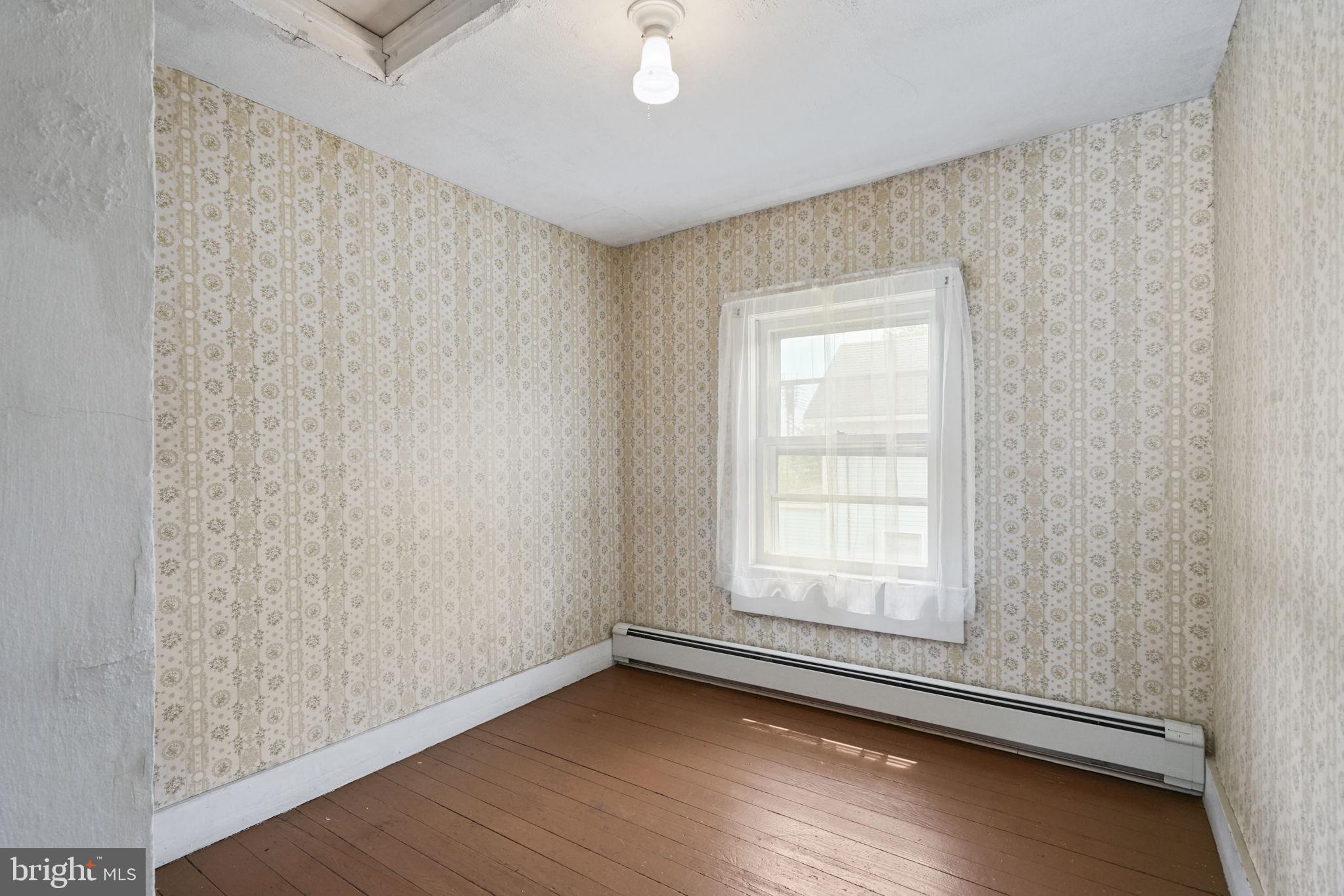 646 Ridge Road Monmouth Junction, NJ 08852 - Photo 17 of 47 Charming room with vintage wallpaper.