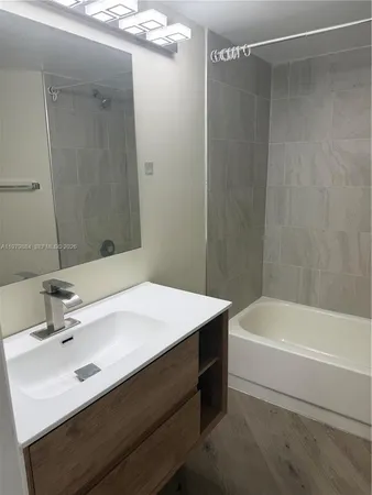 a bathroom with a shower and a bathtub