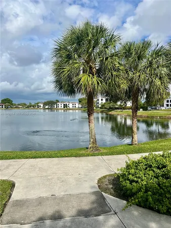 a view of lake with a yard