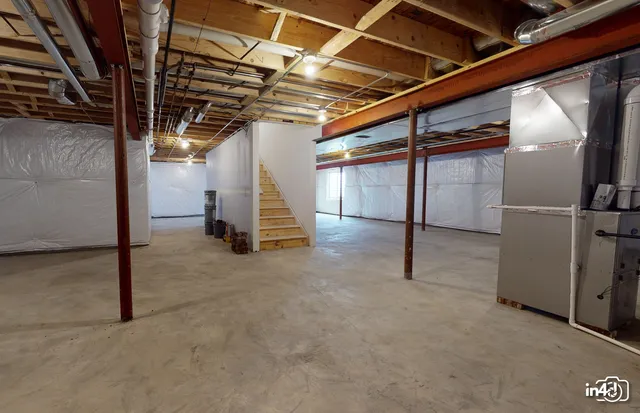 a view of empty room with wooden walls