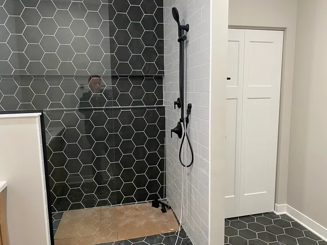 a bathroom with a double vanity sink and a mirror