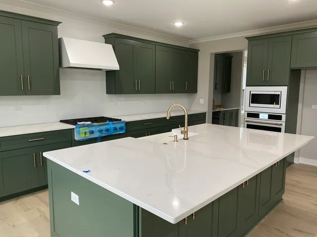 a kitchen with a sink a stove and a refrigerator