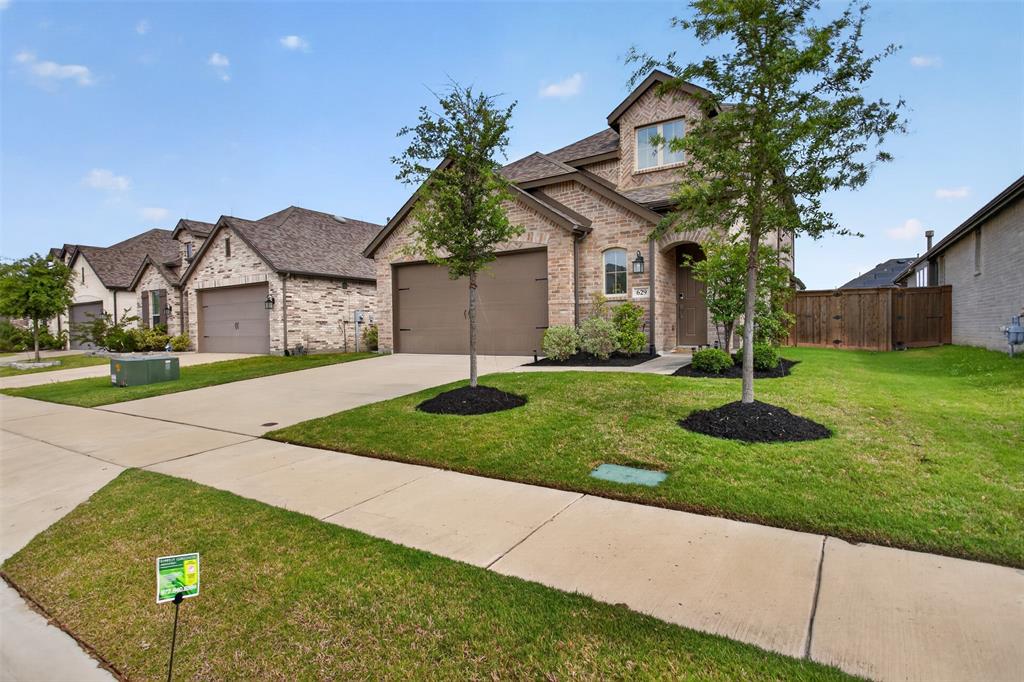 629 Claverton Lane Forney, TX 75126 - Photo 30 of 33 a front view of a house with garden