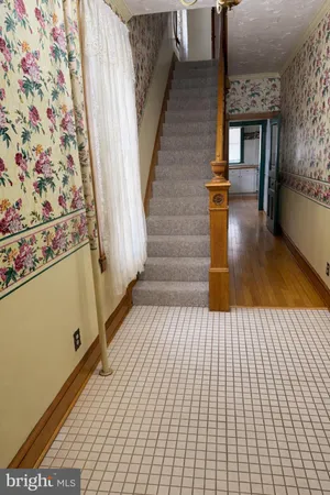 a view of entryway with wooden floor