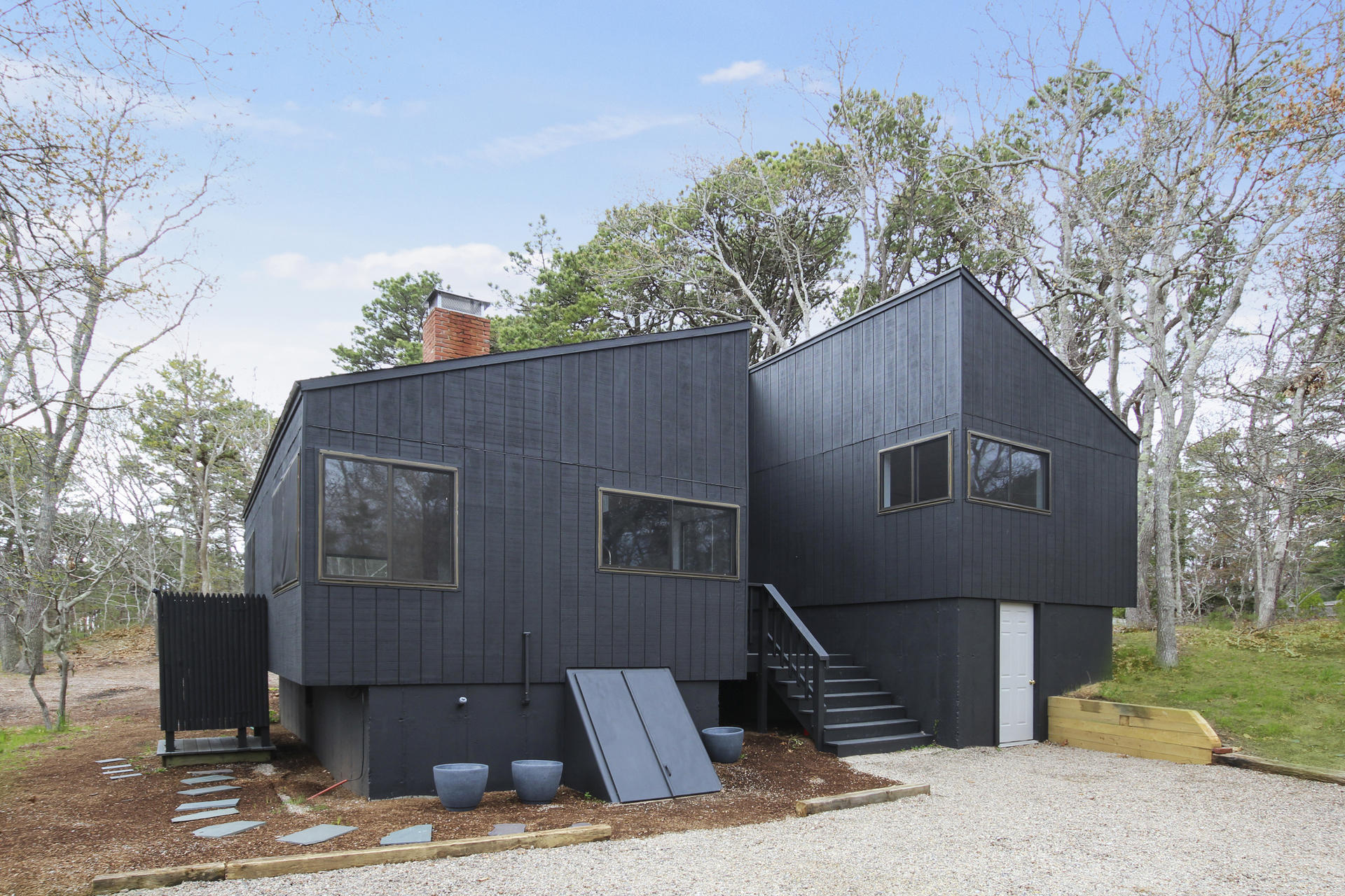 86 Upper Marsh Road Wellfleet, MA 02667 - Photo 1 of 31 a front view of a house with garden
