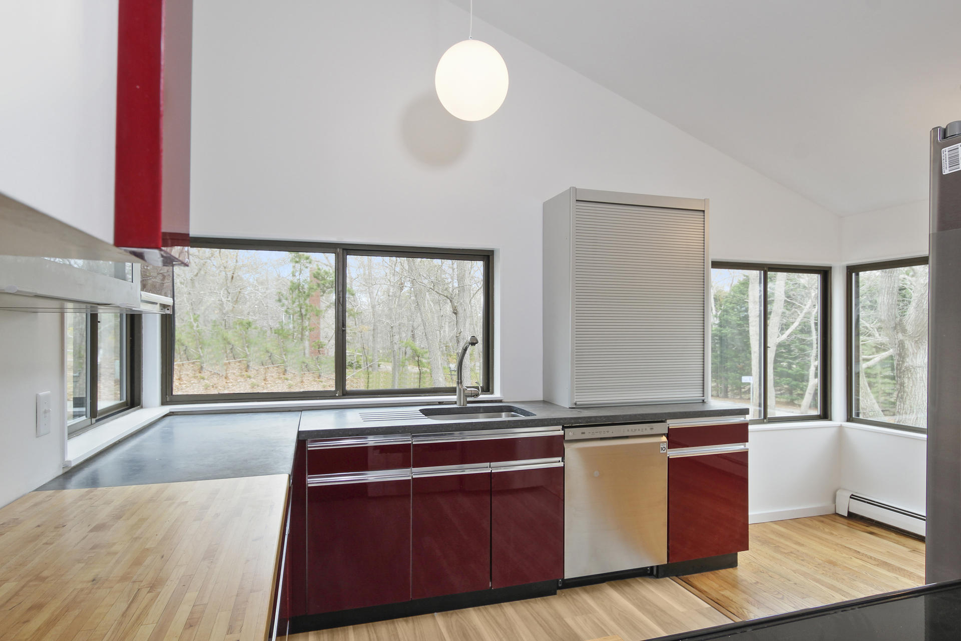 86 Upper Marsh Road Wellfleet, MA 02667 - Photo 11 of 31 a kitchen with stainless steel appliances granite countertop a stove a sink and a microwave
