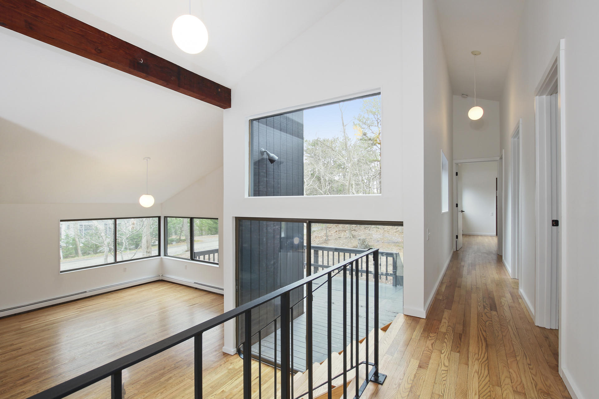 86 Upper Marsh Road Wellfleet, MA 02667 - Photo 14 of 31 a view of a hallway with wooden floor and staircase