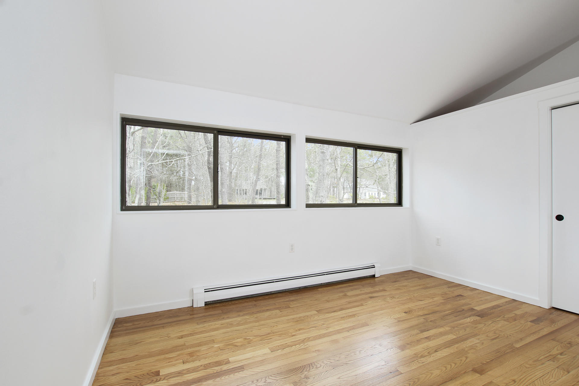 86 Upper Marsh Road Wellfleet, MA 02667 - Photo 18 of 31 a view of empty room with wooden floor and fan