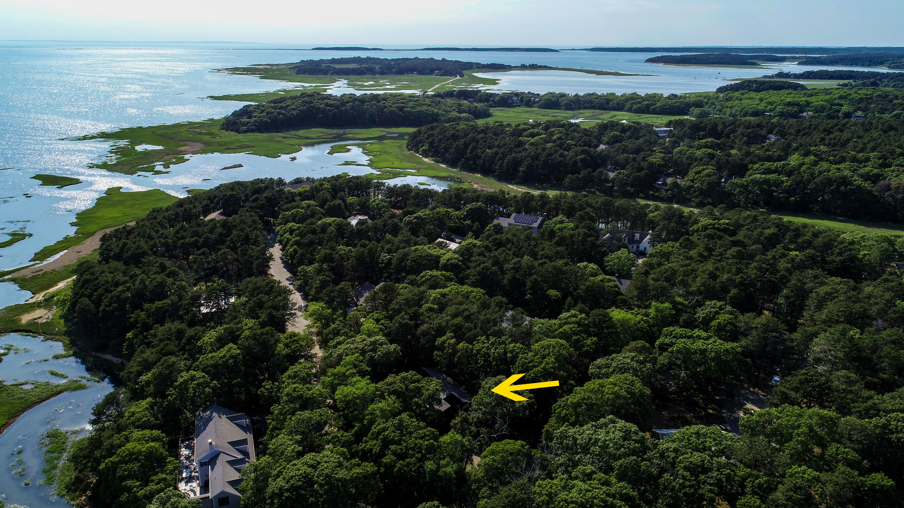 86 Upper Marsh Road Wellfleet, MA 02667 - Photo 4 of 31 a view of a lake with a yard