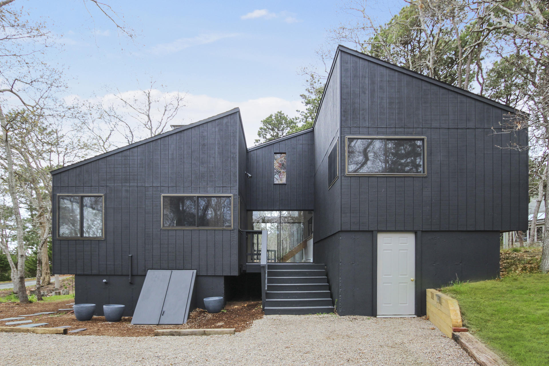 86 Upper Marsh Road Wellfleet, MA 02667 - Photo 5 of 31 a front view of a house with stairs