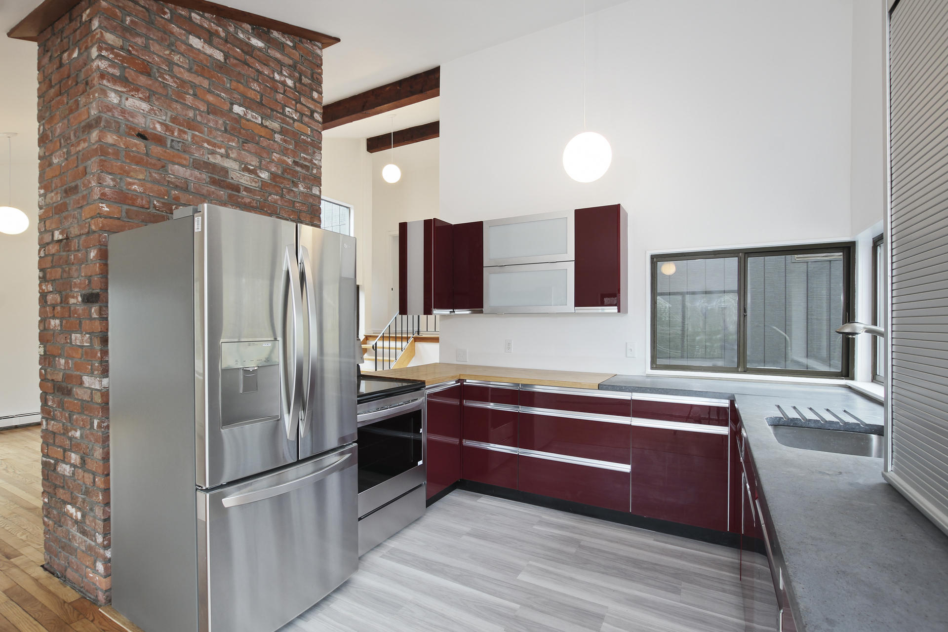 86 Upper Marsh Road Wellfleet, MA 02667 - Photo 10 of 31 a kitchen with stainless steel appliances granite countertop a refrigerator and a sink
