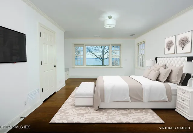 a large white bed in a white room