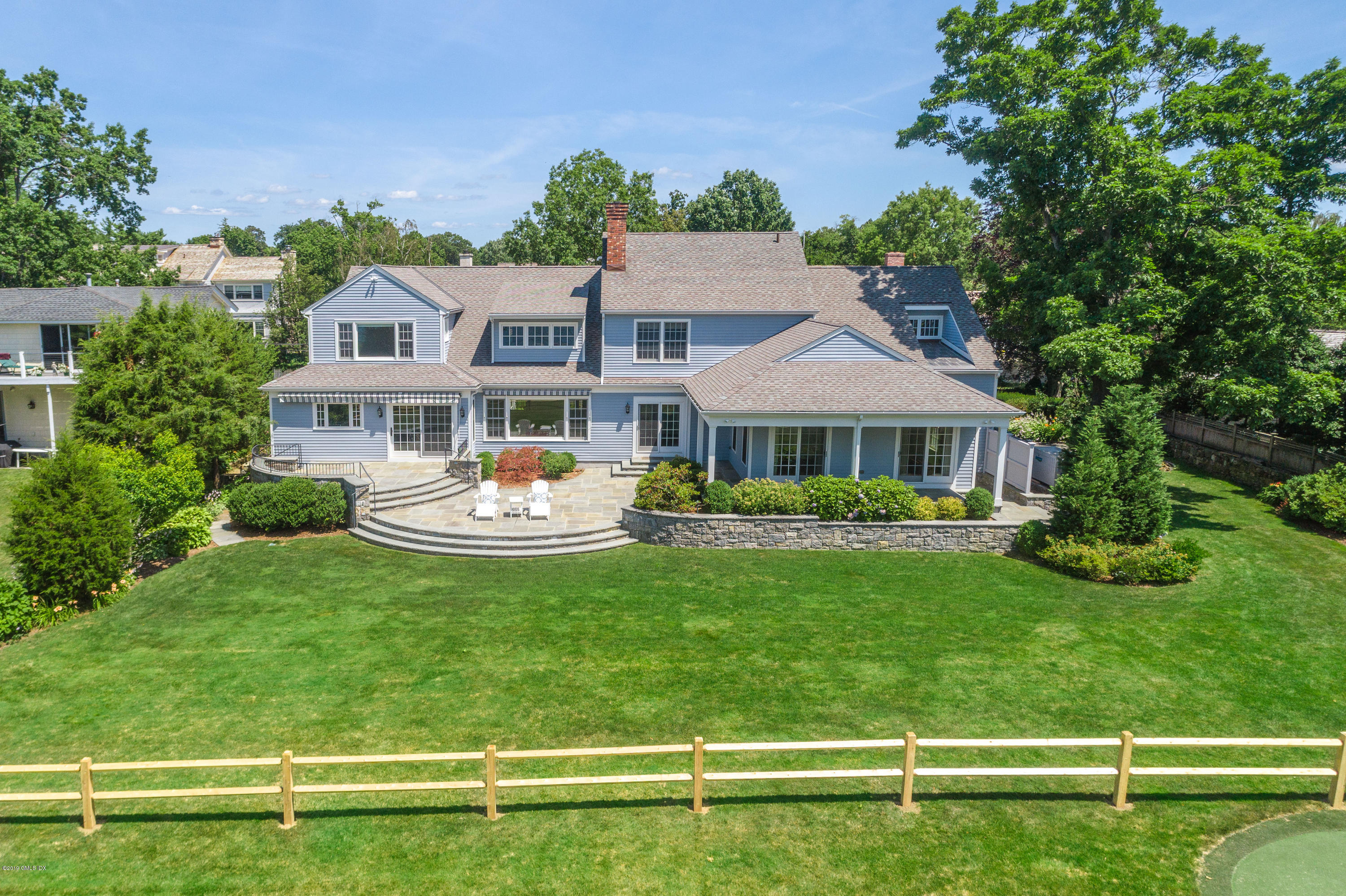 30 Rocky Point Road Old Greenwich, CT 06870 - Photo 24 of 29 a front view of a house with a garden
