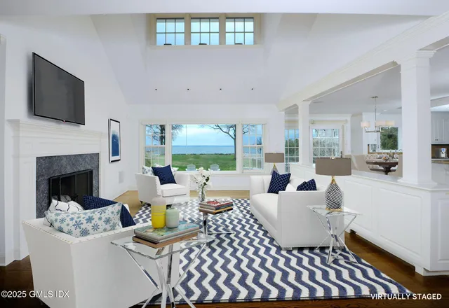 a living room with furniture fireplace and a flat screen tv