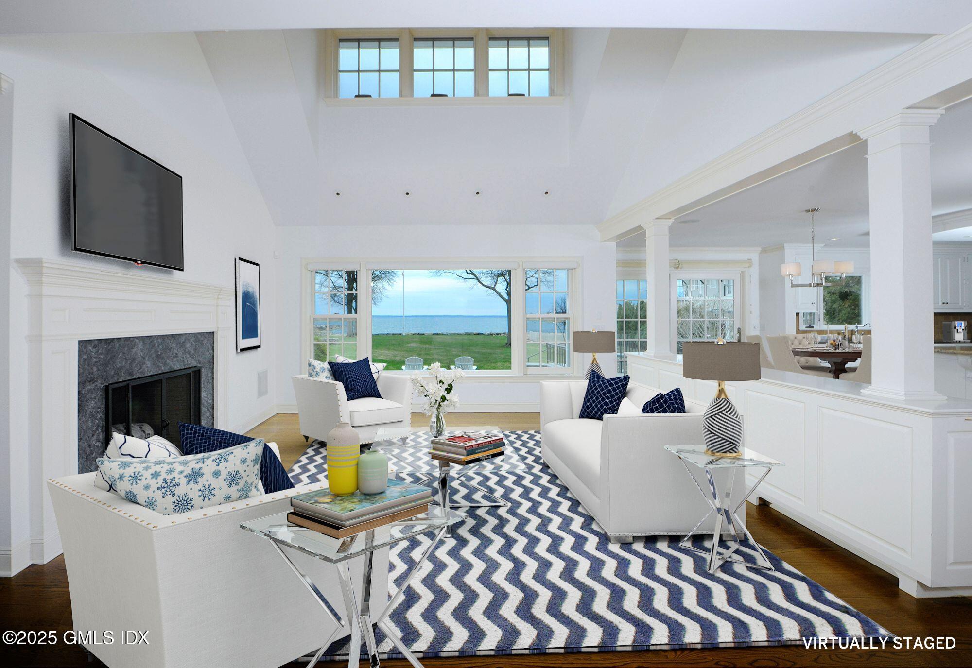 30 Rocky Point Road Old Greenwich, CT 06870 - Photo 4 of 29 a living room with furniture fireplace and a flat screen tv