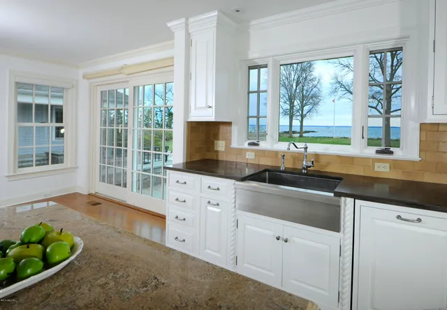 a kitchen that has a sink and a window in it