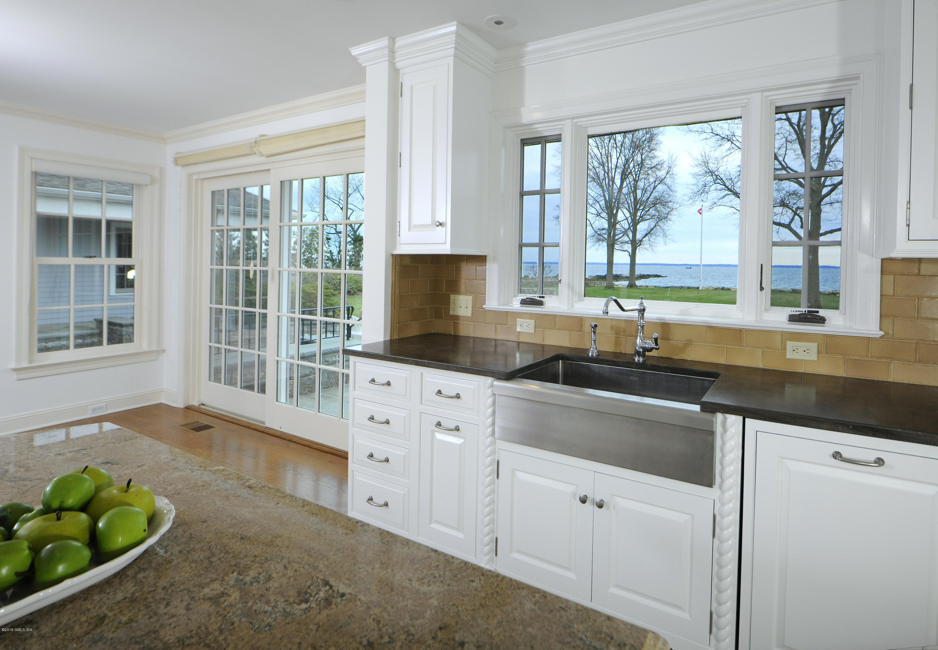 30 Rocky Point Road Old Greenwich, CT 06870 - Photo 7 of 29 a kitchen that has a sink and a window in it