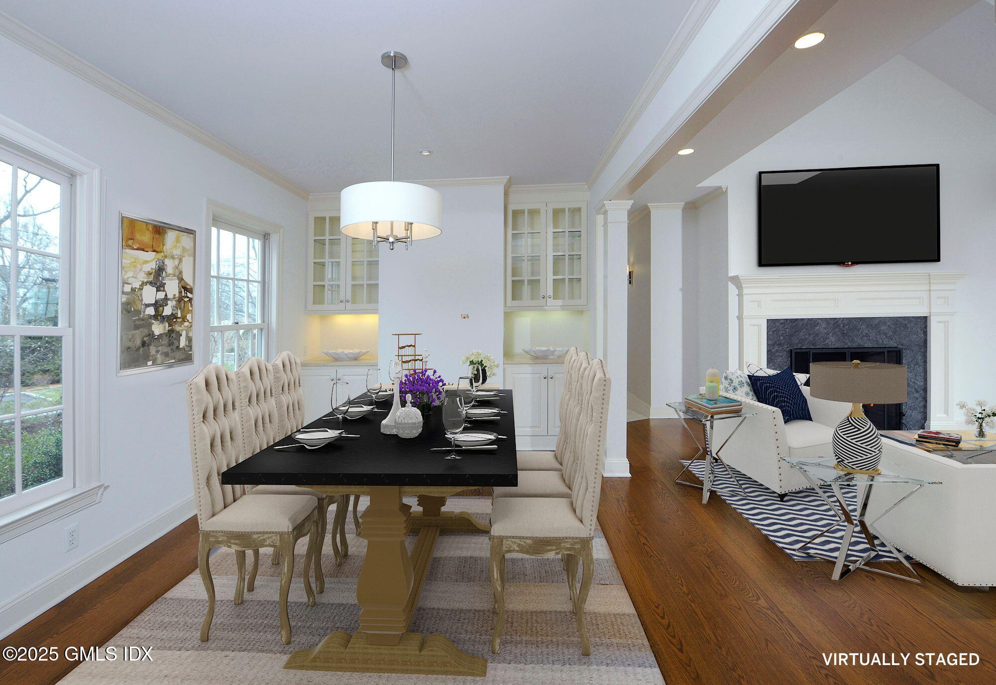 30 Rocky Point Road Old Greenwich, CT 06870 - Photo 10 of 29 a living room with furniture a flat screen tv and a fireplace