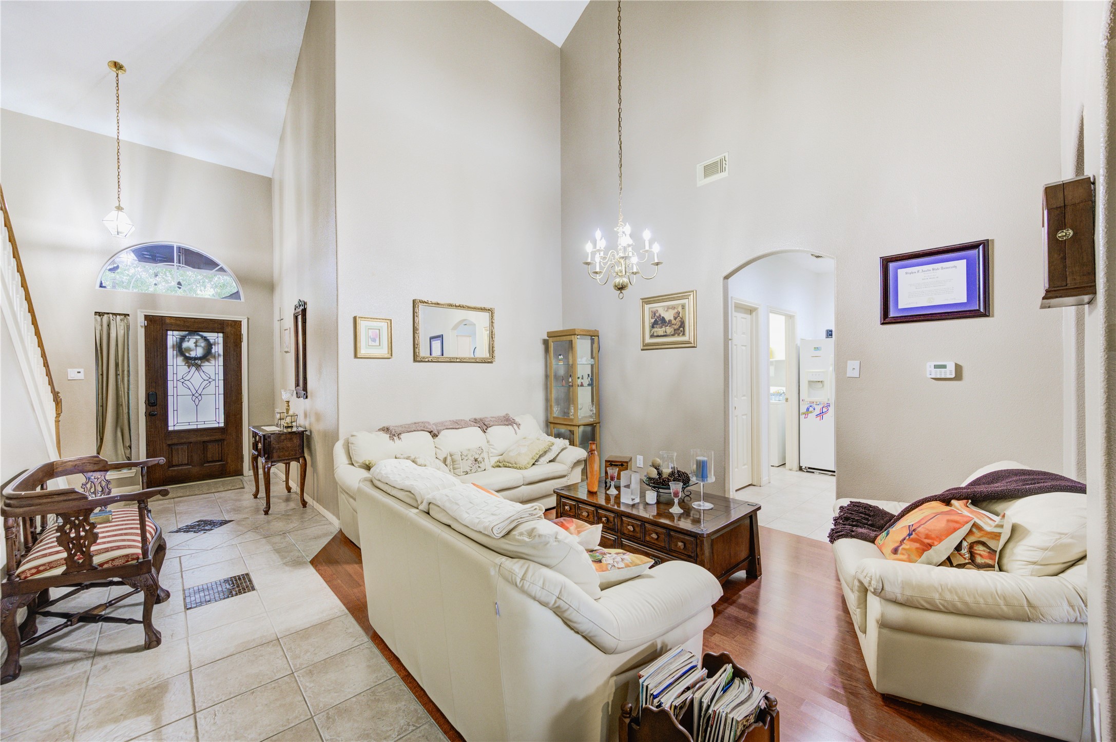16730 Spring Barker Drive Cypress, TX 77429 - Photo 16 of 50 a living room with furniture and a chandelier